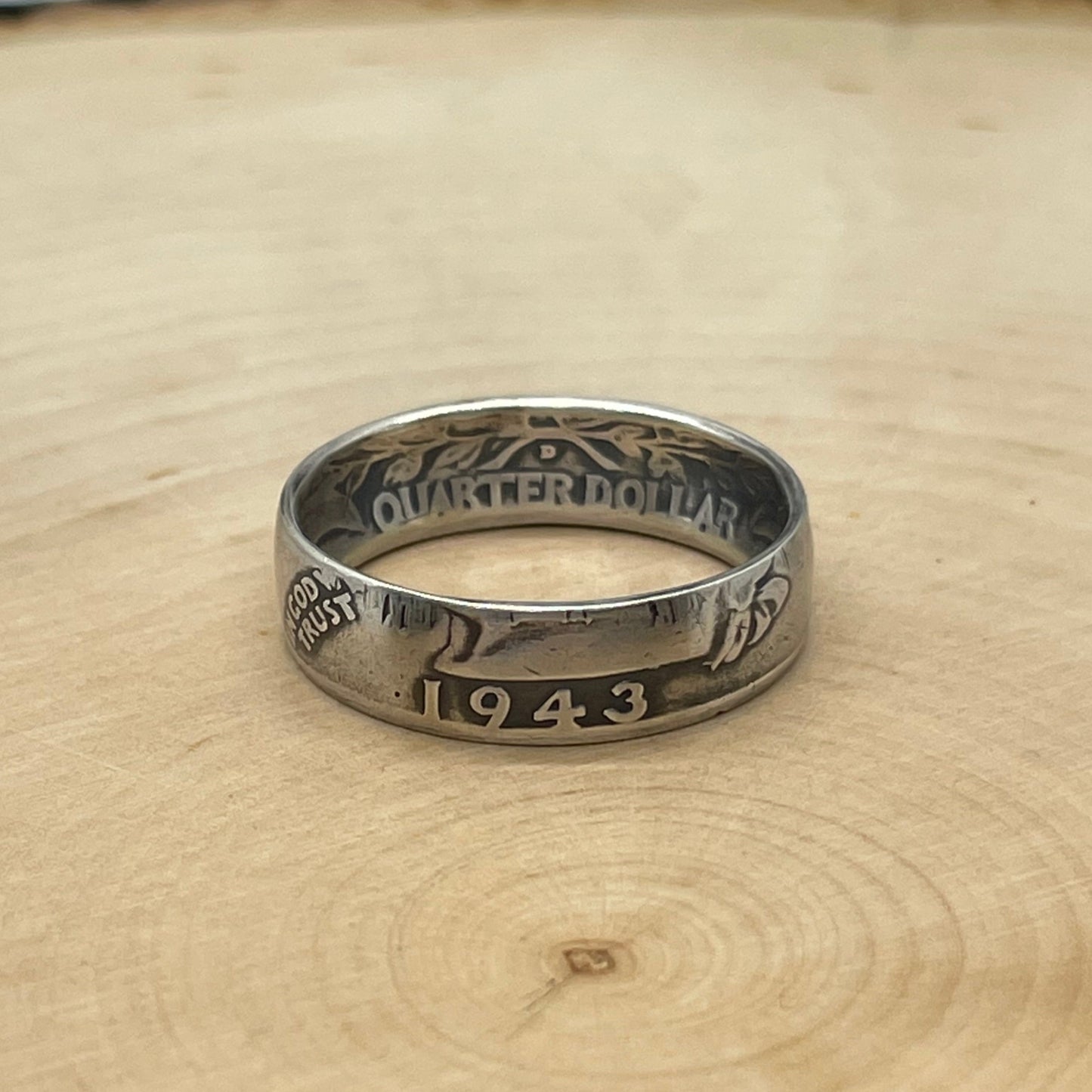 Washington Silver Quarter Coin Ring (front) on a light wood round. - Mountainstruck Coin Jewelry