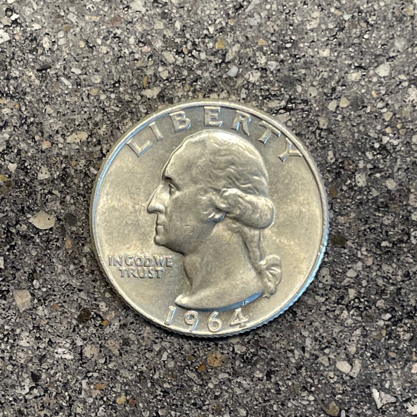 Washington Silver Quarter Coin front on a concrete background. - Mountainstruck Coin Jewelry