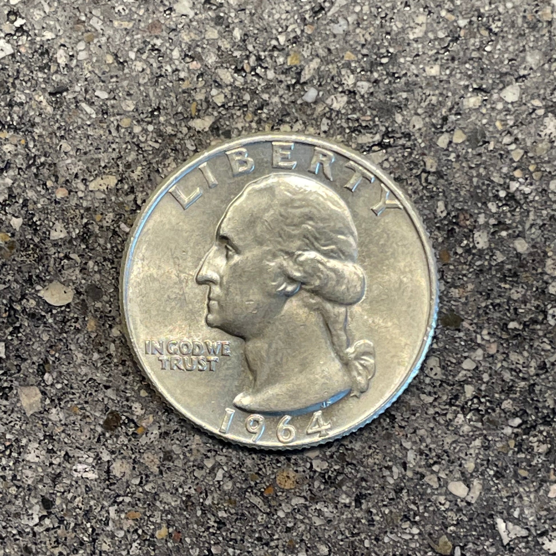 Washington Silver Quarter Coin front on a concrete background. - Mountainstruck Coin Jewelry