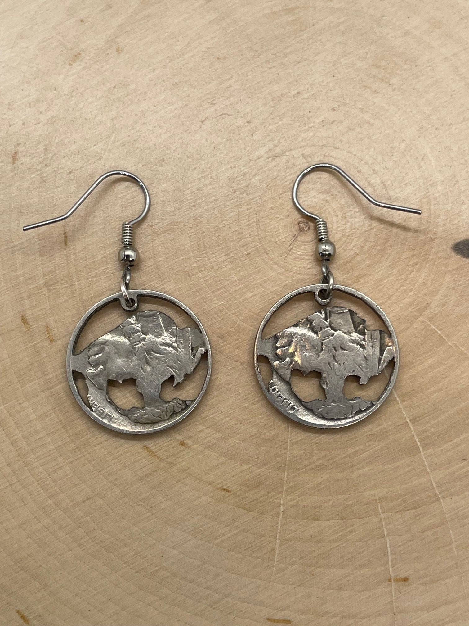 U.S. Buffalo Nickel Coin Earrings backside on a light wood round.