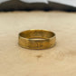 U.S. Gold Eagle 1/4 oz Fine Gold Coin Ring on a light wood round.
