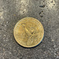 Gold U.S. Presidential Dollar Coin back on a concrete background - Mountainstruck Coin Jewelry