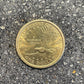 Sacagawea Dollar Coin back on a concrete background.