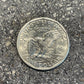 Susan B. Anthony Dollar Coin back on a concrete background.