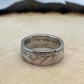 Australia Silver Florin Coin Ring on a light wood background.