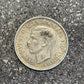 Australia Silver Florin front of coin on a concrete background.