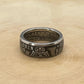 UK One Florin Silver Coin Ring on a light wood round.