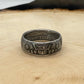 UK One Florin Silver Coin Ring on a light wood round.