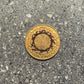 Suriname 1 Cent Coin back on a concrete background.
